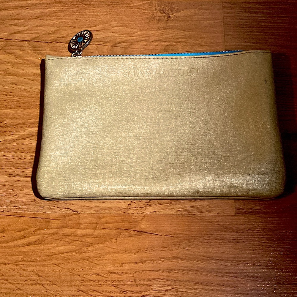 Bright gold and blue color with a cute sun zipper